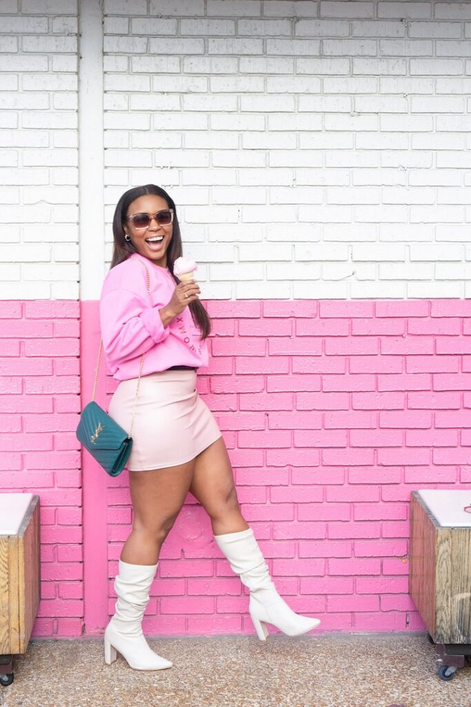 stylish dressed in pink with skirt and boots